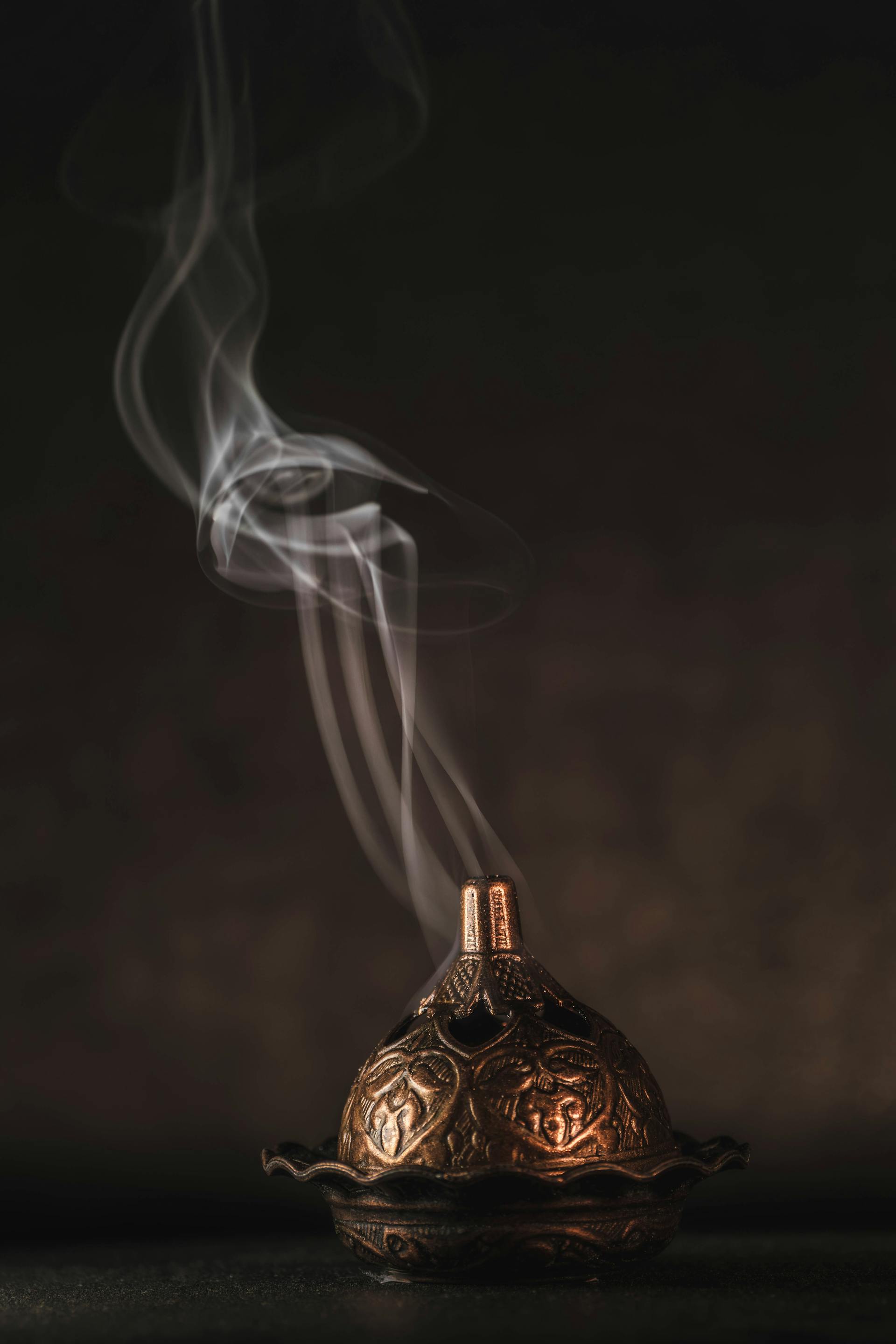 Oud incense ritual — the house signature